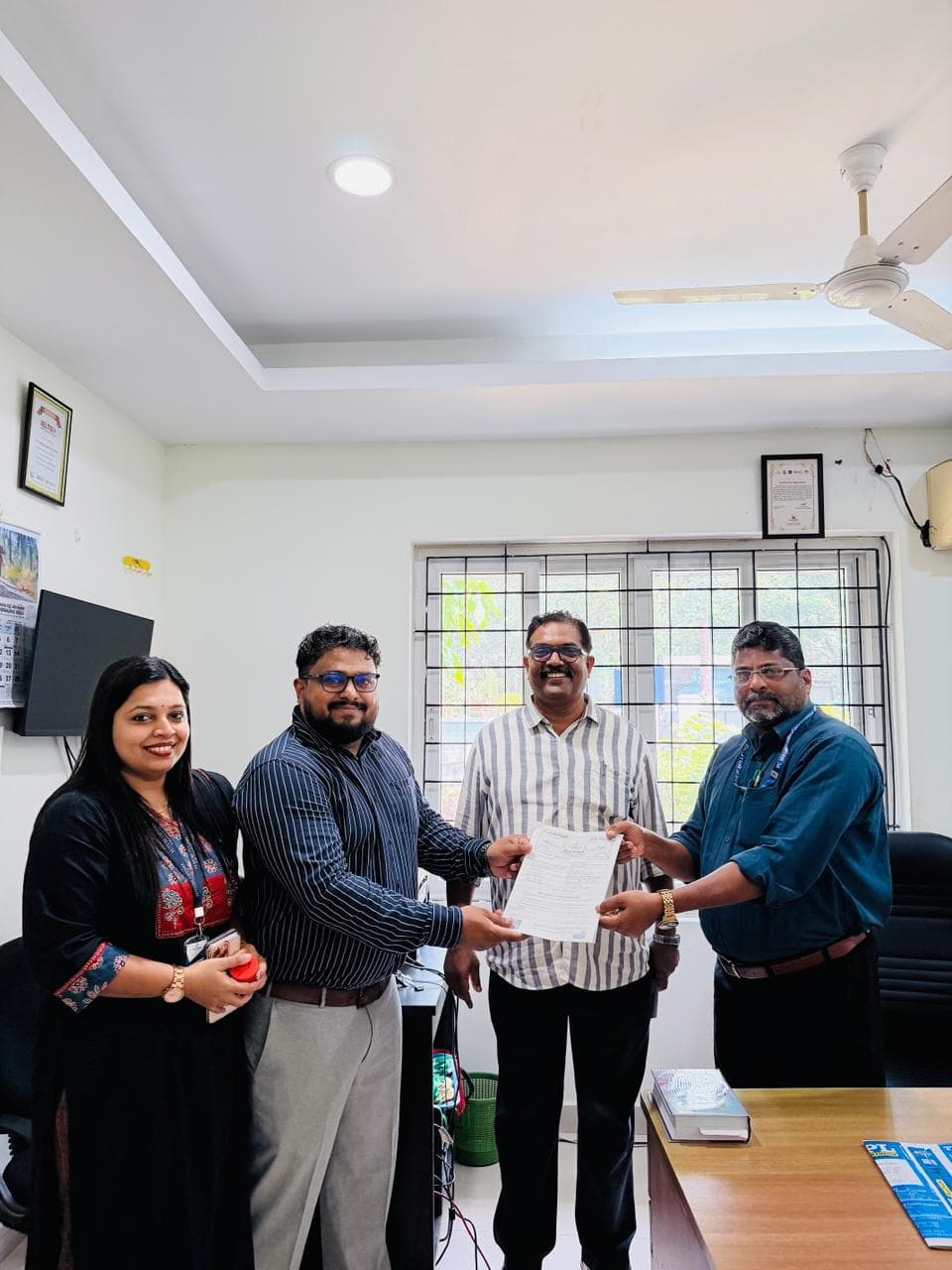 Representatives of Future Optima IT Solutions and MC Varghese College of Arts and Science, Kottayam, at the MoU signing
